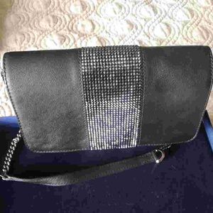 Swarovski black leather mini bag with crystal detailing. Comes in original box.